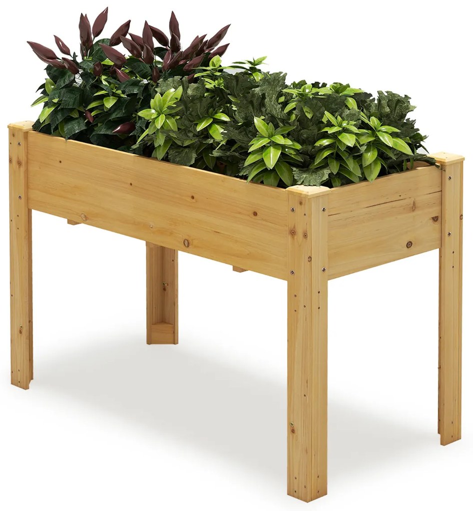 Floreira jardim elevada para plantas em madeira com orifícios de drenagem e espaços para frutas, legumes e ervas aromáticas natural