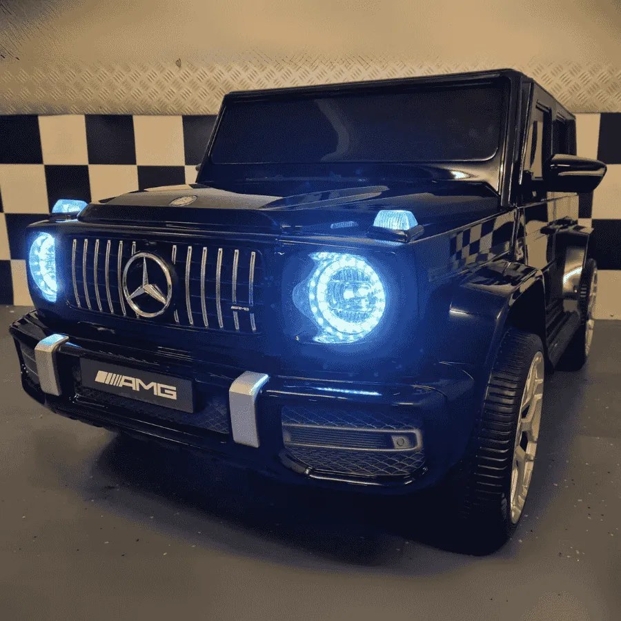Carro Infantil Mercedes G63 2 lugares 12V,Pneus Borracha, Assento de couro preto metálico