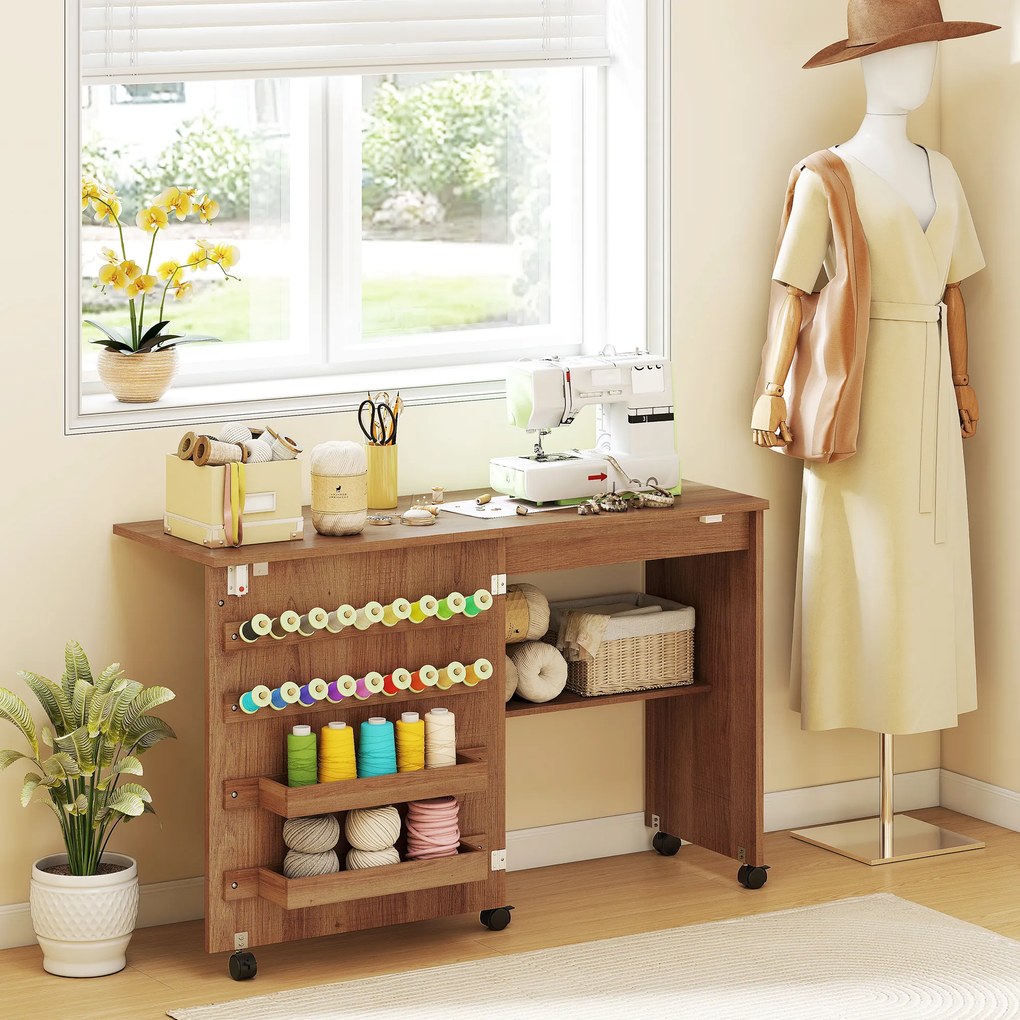 Mesa para Máquina de Costura Dobrável com Porta Magnética, 2 Compartimentos, Prateleira, 18 Suportes para Linhas e 5 Rodas, Castanho