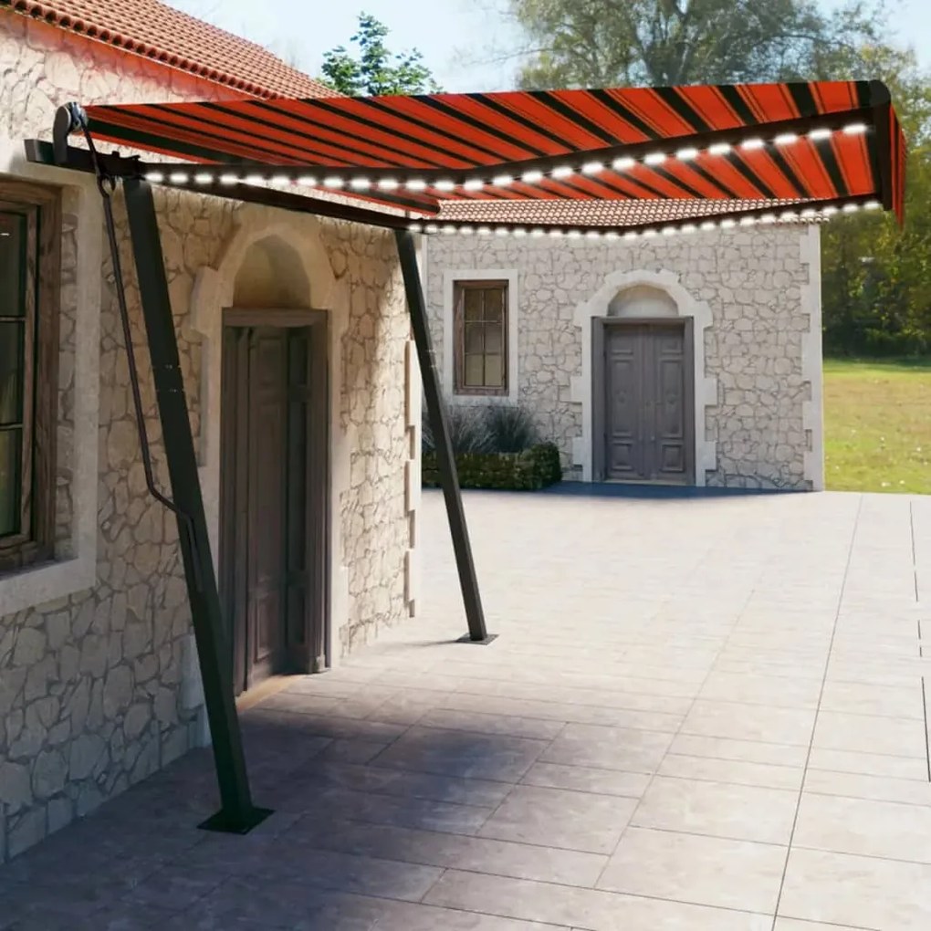 vidaXL Toldo retrátil manual com luzes LED 4x3 m laranja e castanho