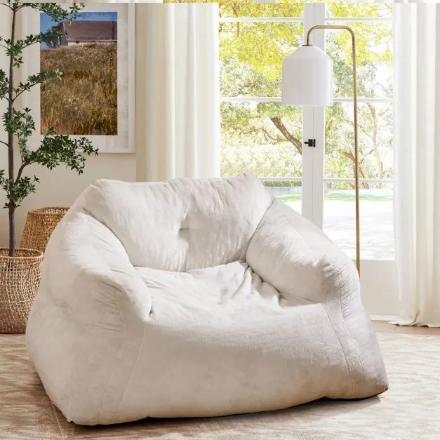 Pufe tipo poltrona, com estofamento em veludo e base antiderrapante 129 x 111 x 69 cm bege