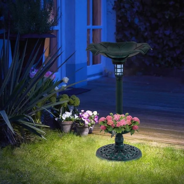 Fonte para pássaros com luz solar verde