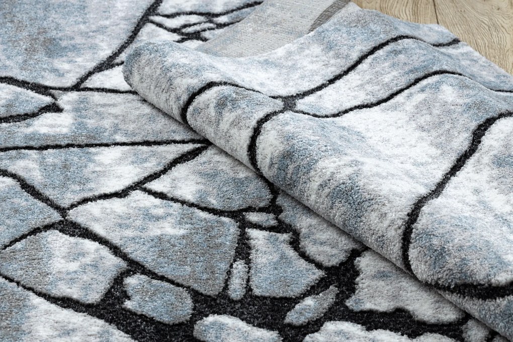 Tapete moderno COZY 8873 Cracks, concreto rachado - Structural dois níveis de lã cinza claro / azul