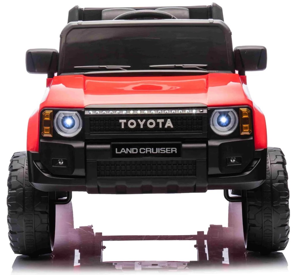 Jipe elétrico para crianças Toyota Landcruiser 12V controlo remoto de 2,4 GHz, entrada USB/AUX, Bluetooth, suspensão, bateria de lítio, luzes LED Verm