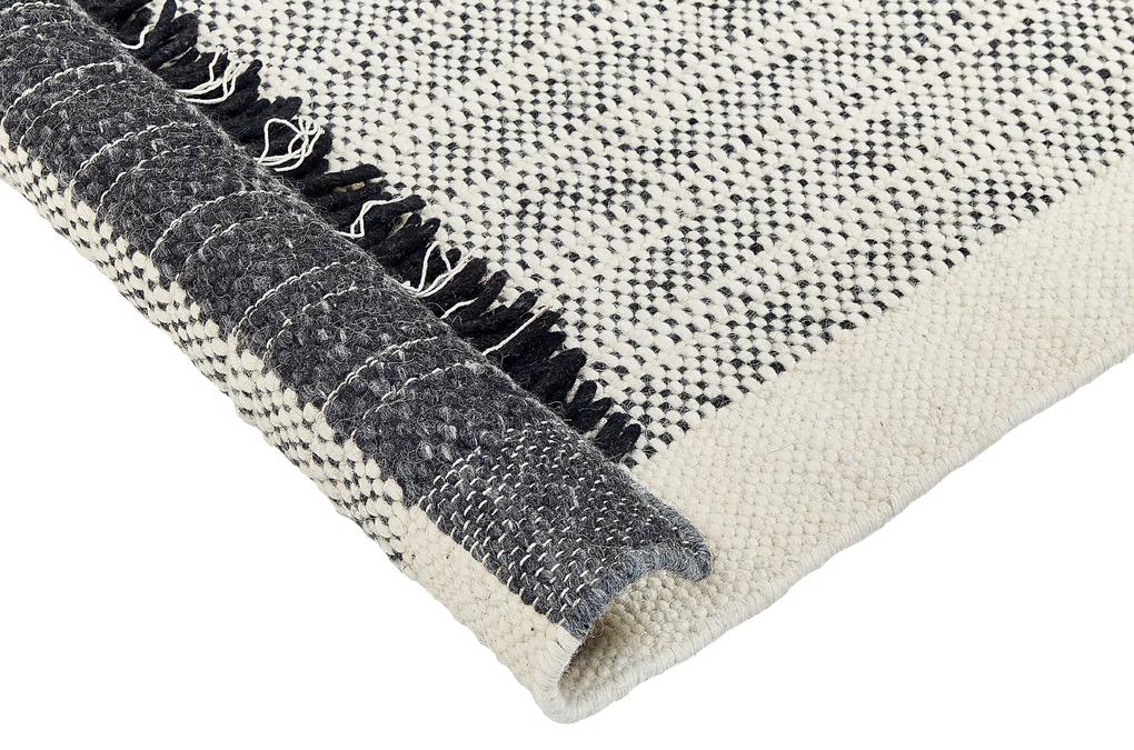 Tapete de lã preta e branca 140 x 200 cm KETENLI Beliani