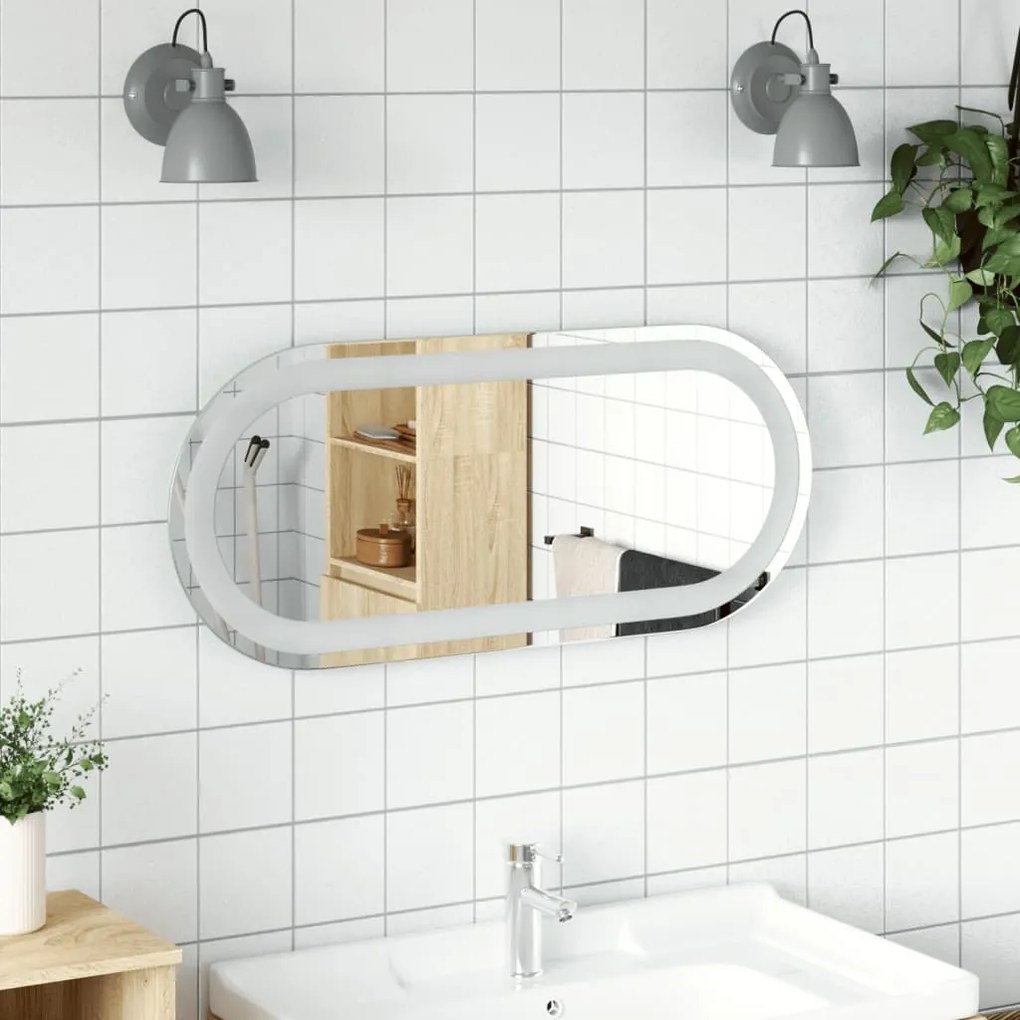 vidaXL Espelho de casa de banho com luzes LED oval 70x30 cm