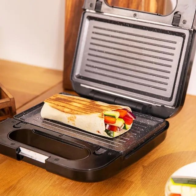 Sanduicheira 4 em 1 Rock´nToast. 1000 W de potência, capacidade para 2 sandes, acabamentos em aço inoxidável, 4 placas intercambiáveis com revestiment