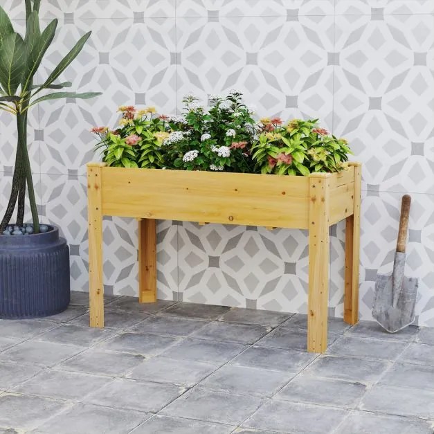 Floreira jardim elevada para plantas em madeira com orifícios de drenagem e espaços para frutas, legumes e ervas aromáticas natural