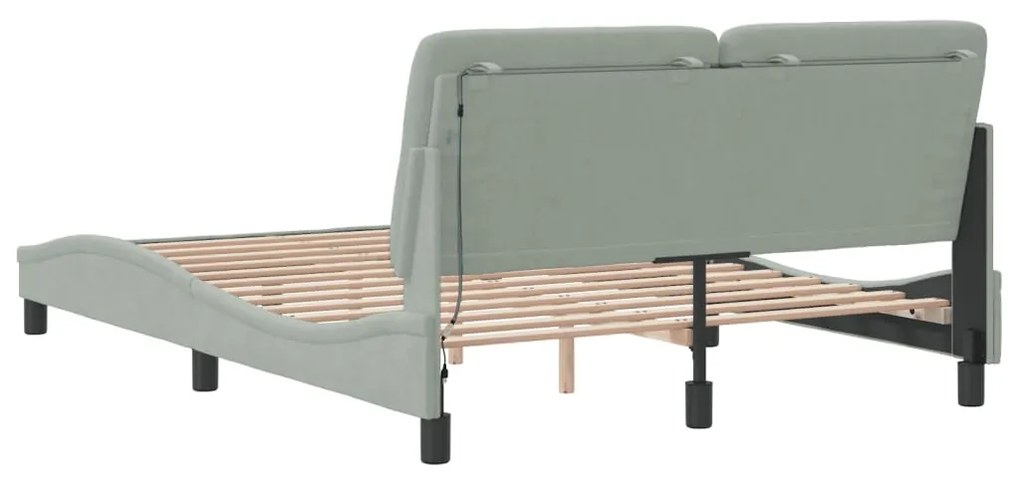 Estrutura de cama c/ luzes LED 140x190 cm veludo cinzento-claro