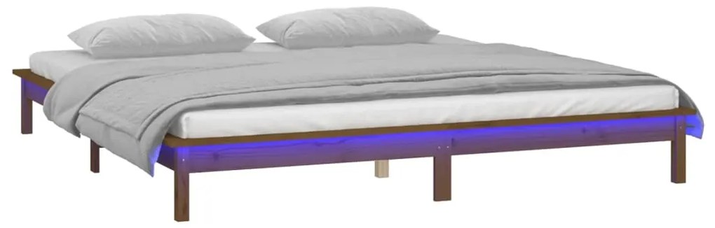 Estrutura de cama c/ LED 140x190 cm madeira maciça castanho-mel