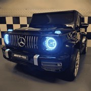 Carro Infantil Mercedes G63 2 lugares 12V,Pneus	Borracha, Assento de couro  preto metálico