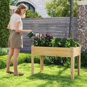 Floreira jardim elevada para plantas em madeira com orifícios de drenagem e espaços para frutas, legumes e ervas aromáticas natural
