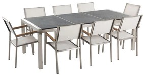 Conjunto de mesa com tampo triplo granito flameado preto 220 x 100 cm e 8 cadeiras brancas GROSSETO Beliani