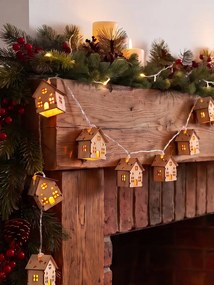 Grinalda luminosa de casas em madeira bege