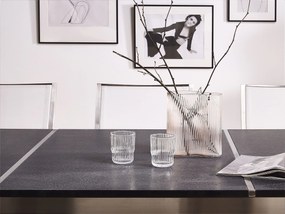 Conjunto de mesa com tampo triplo granito flameado preto 220 x 100 cm e 8 cadeiras brancas GROSSETO Beliani