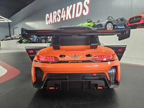 Carro elétrico infantil Mercedes GT3 AMG 12V Com pneus de borracha e Assento em couro Laranja