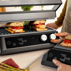 Grelhador elétrico de 2400 W Rockn'Grill Bistro com sistema Smokeless que ajusta o tempo e temperatura em função de modo e o ponto de cozedura selecio