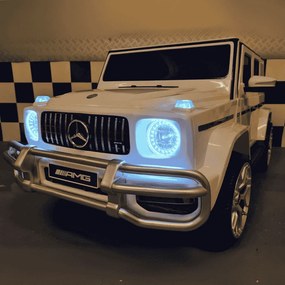 Carro infantil a bateria Mercedes G63 2 lugares 12V, Pneus	Borracha, Assento couro branco