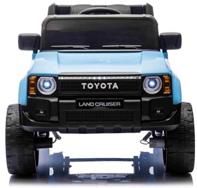 Jipe elétrico para crianças Toyota Landcruiser 12V controlo remoto de 2,4 GHz, entrada USB/AUX, Bluetooth, suspensão, bateria de lítio, luzes LED Azul