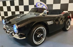 Carro elétrico infantil  para crianças 3 a 6 anos BMW 507 12 volts Pneus Borracha e controlo remoto 2.4G e arranque lento Preto